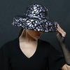 lavender dress hat with black design