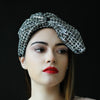 classy lady wearing beautiful silver and black church hat