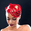 ladies fascinator in red and yellow