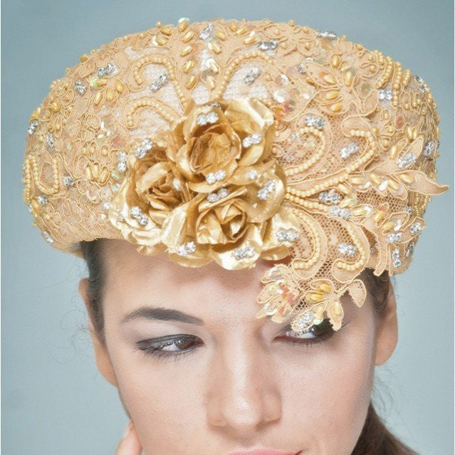NA1020-Cream dress hat with beaded gold lace fabric and rhinestones - SHENOR COLLECTIONS